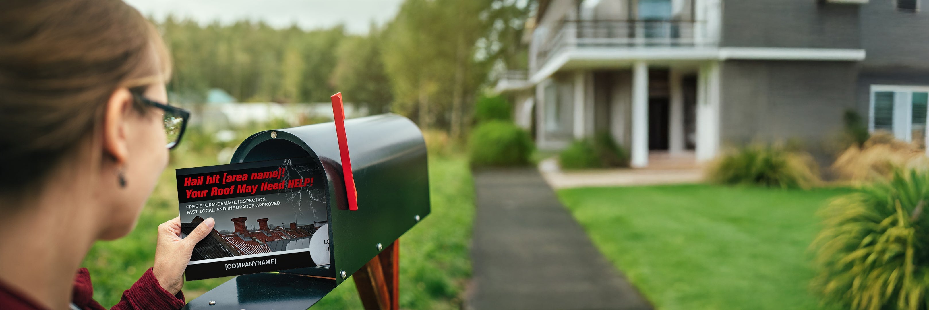 Recipient pulling a professionally printed marketing postcard from mailbox, illustrating a targeted direct mail campaign.